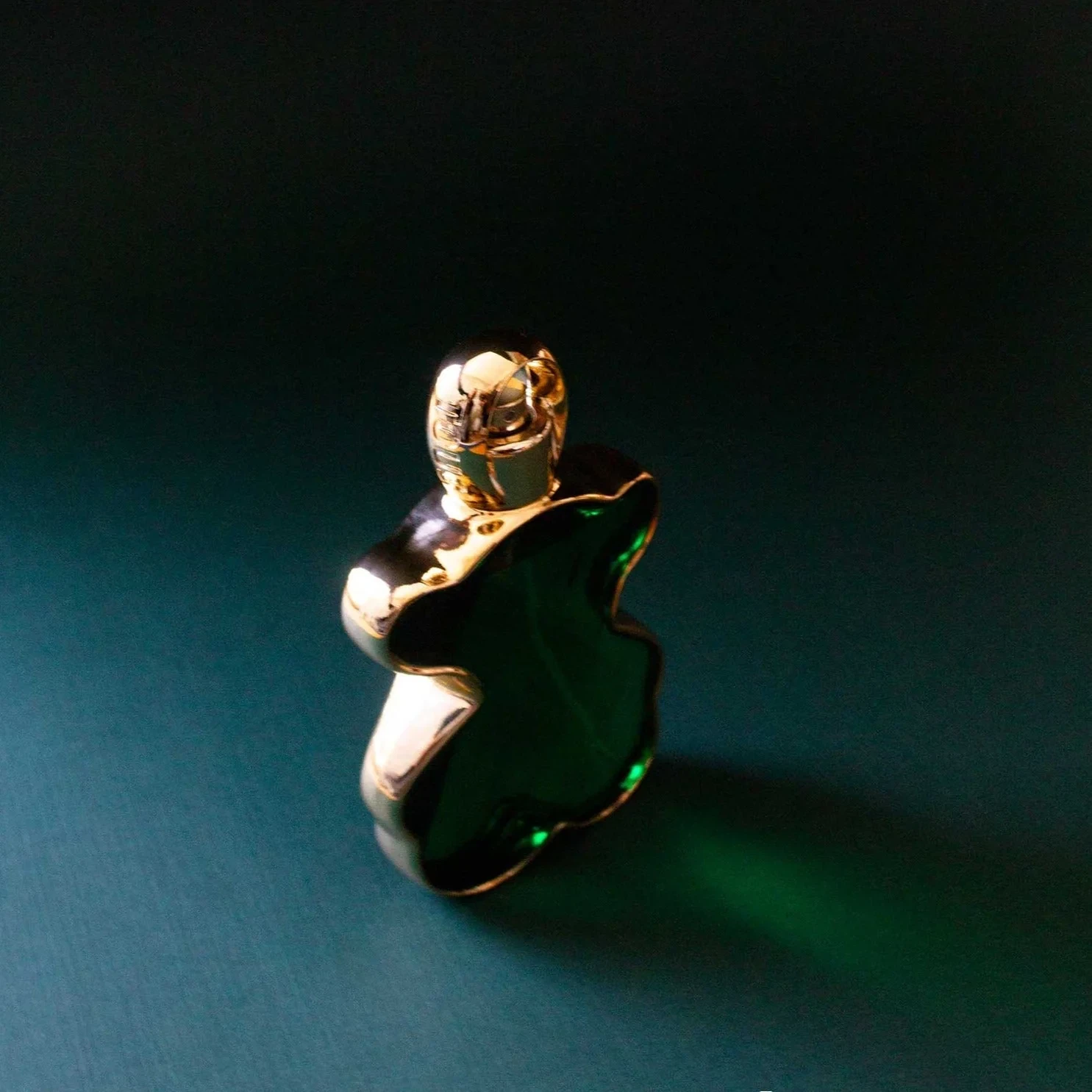 Tous Loveme The Emerald Elixir Elixir Parfum manufacturer bottle, linked from the supplied product catalogue.
