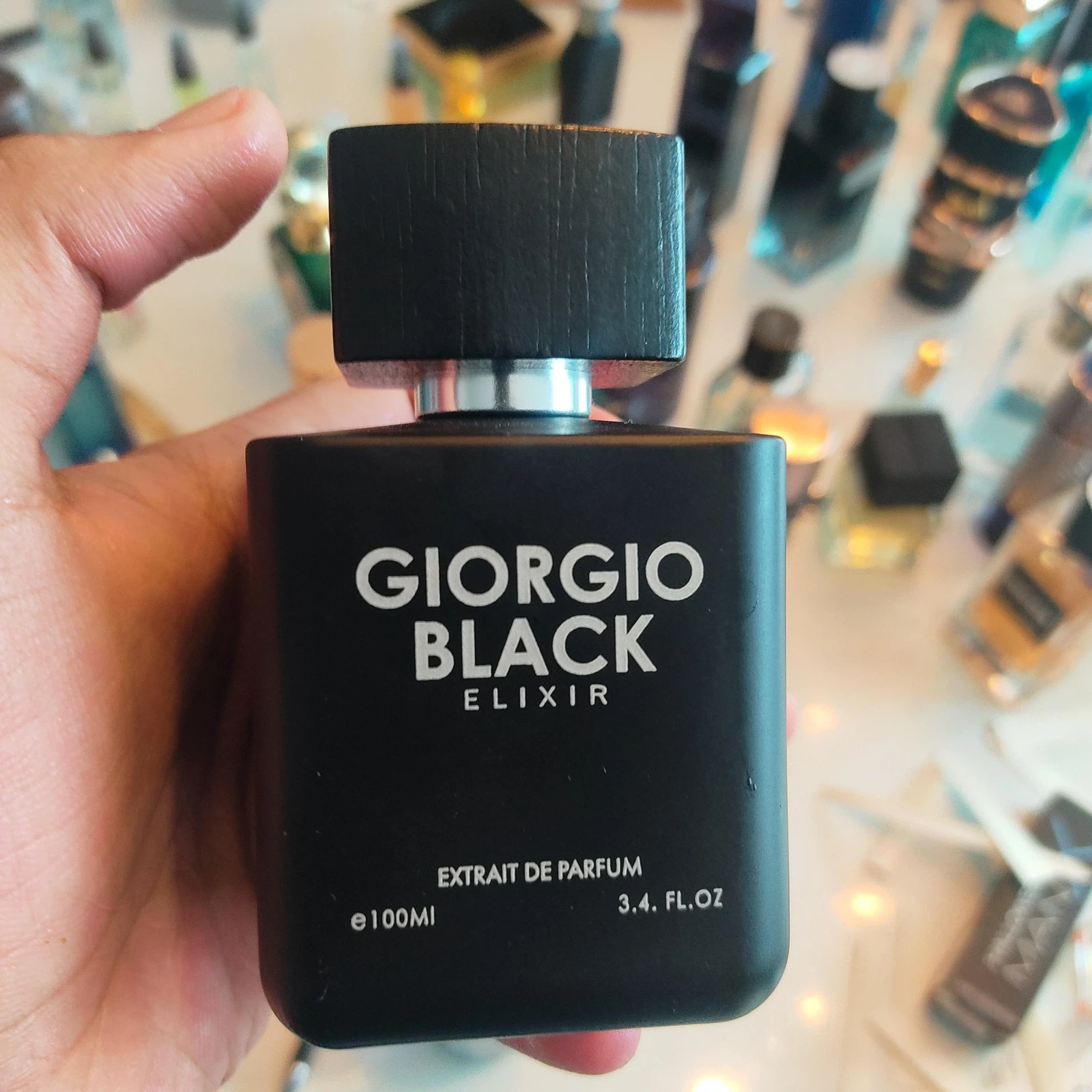 Giorgio Black Elixir manufacturer bottle, linked from the supplied product catalogue.