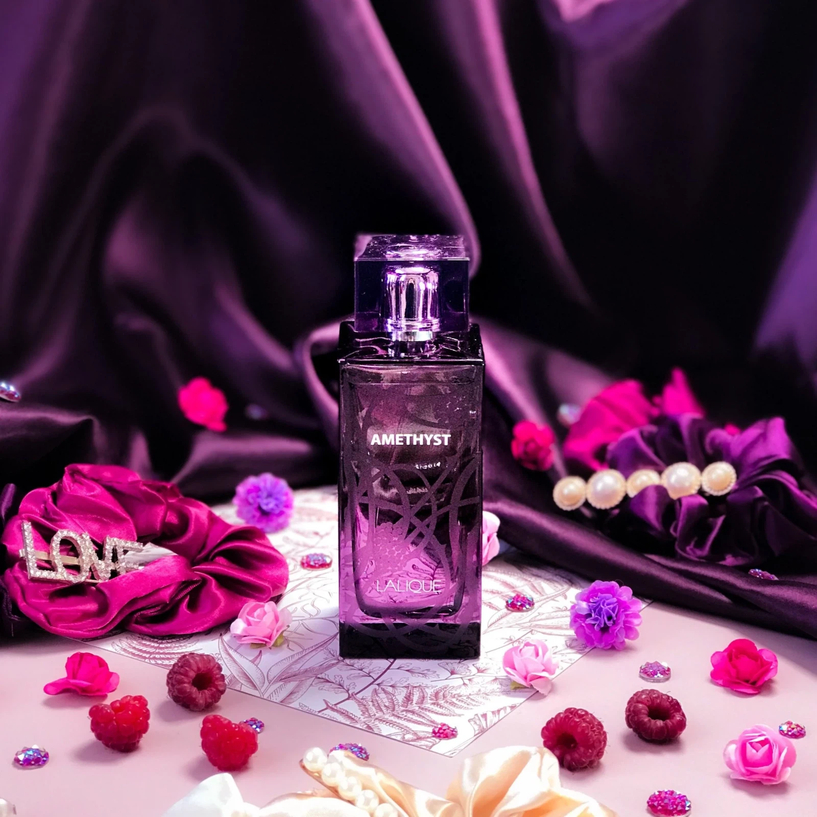 Lalique Amethyst Exquise manufacturer bottle, linked from the supplied product catalogue.