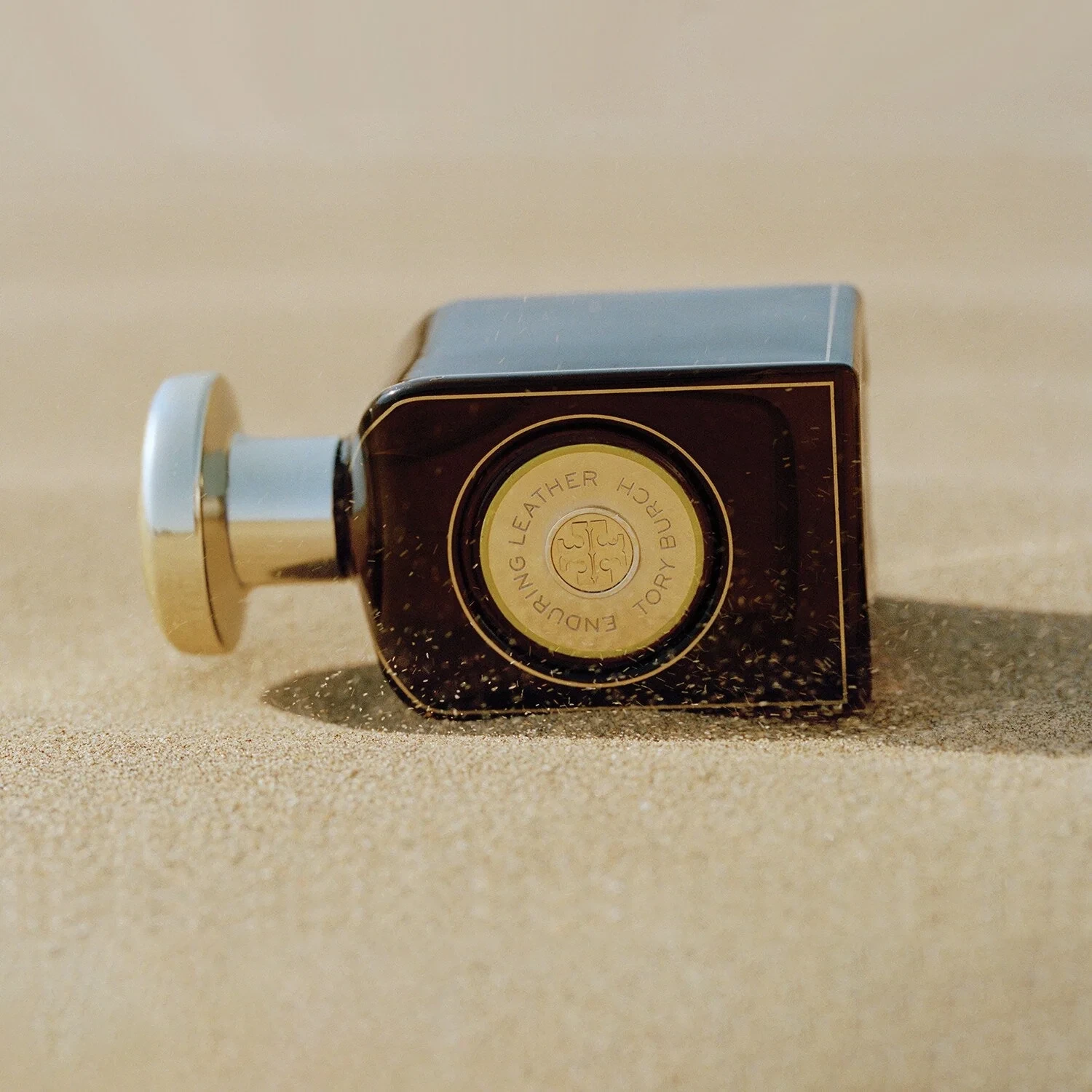 Tory Burch Enduring Leather manufacturer bottle, linked from the supplied product catalogue.