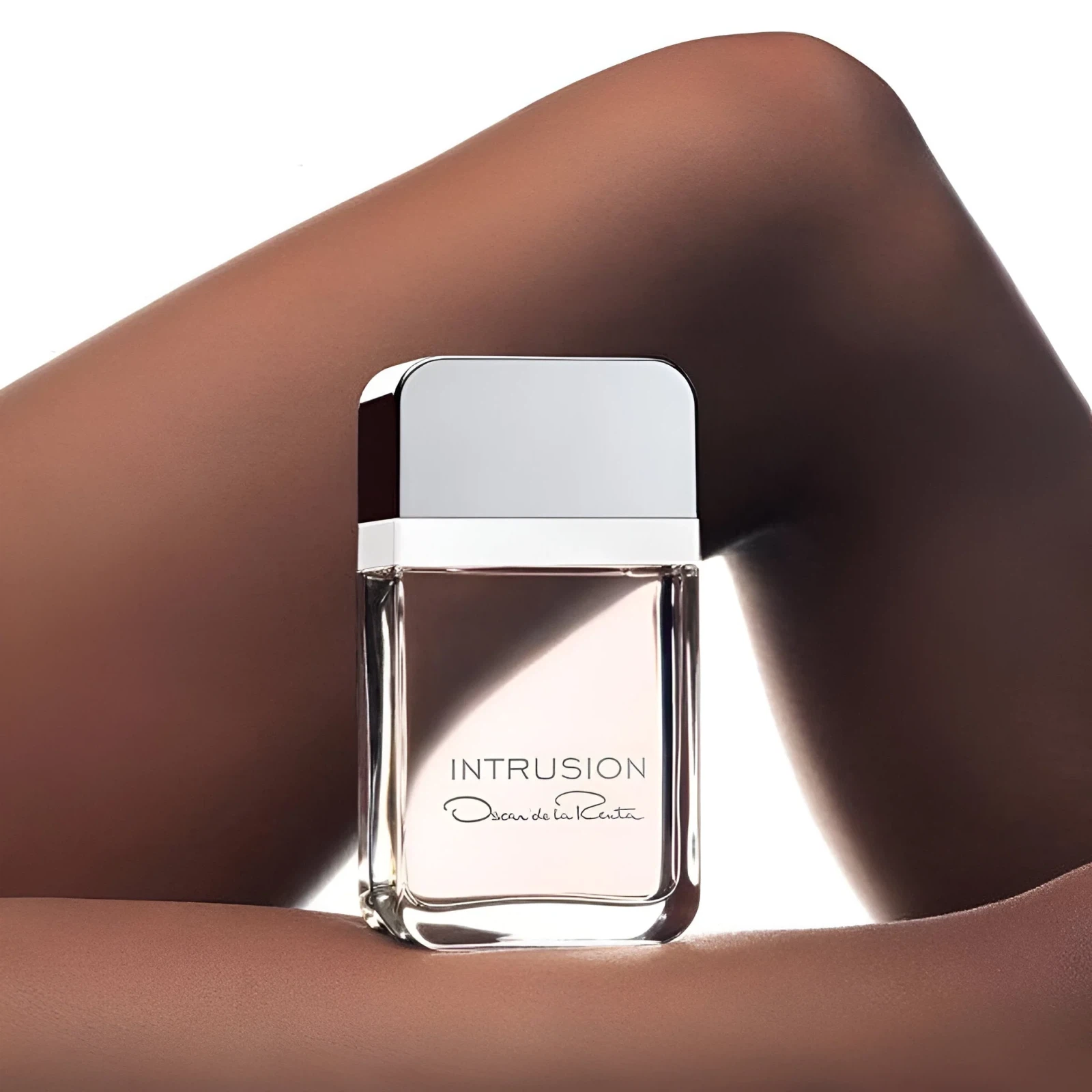 Oscar de la Renta Intrusion manufacturer bottle, linked from the supplied product catalogue.