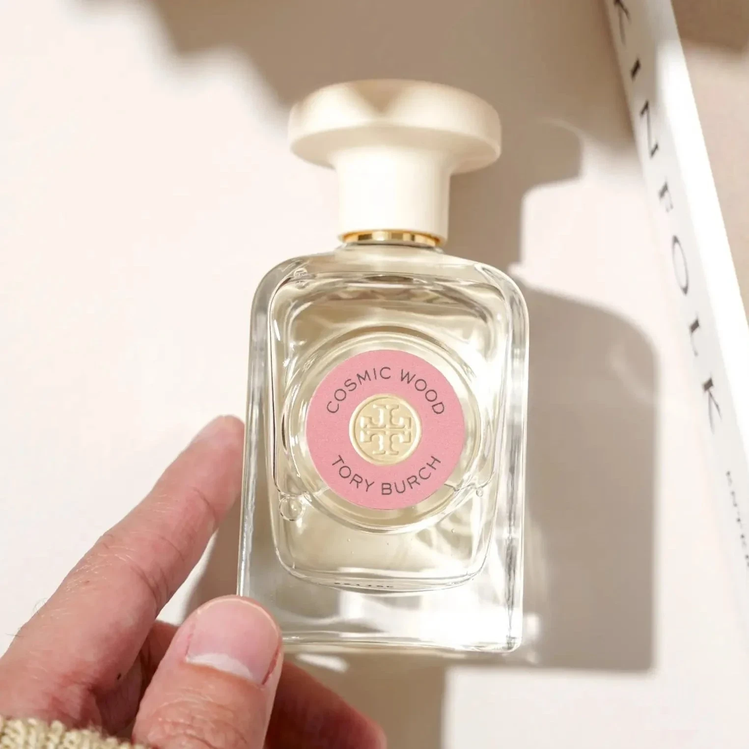 Tory Burch Cosmic Wood manufacturer bottle, linked from the supplied product catalogue.